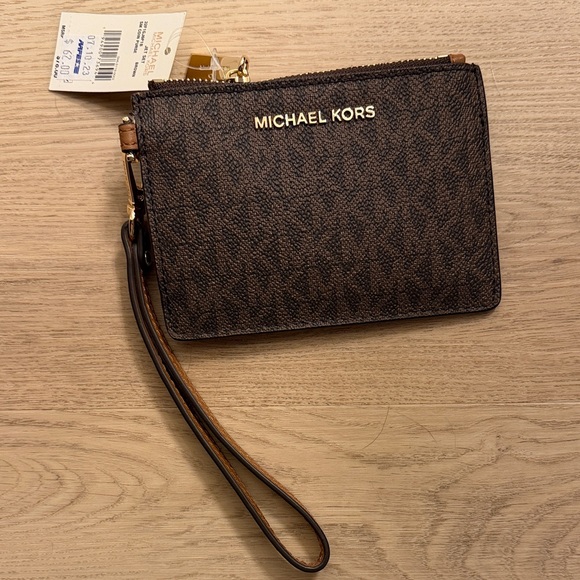 Michael Kors Handbags - Michael Kors Dark Brown Wristlet